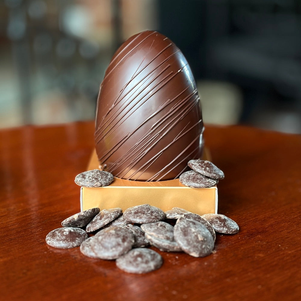 A handcrafted dark chocolate Easter Egg. Rich, decadent and filled with dark chocolate buttons. Vegetarian and vegan friendly!